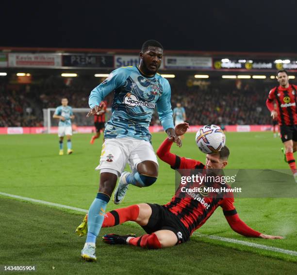 Ainsley Maitland-Niles of Southampton avoids the challenge from Chris Mepham of AFC Bournemouth during the Premier League match between AFC...