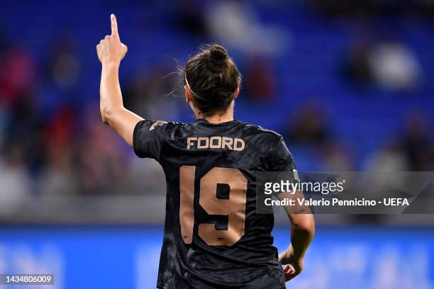 Caitlin Foord of Arsenal celebrates after scoring their sides first goal during the UEFA Women's Champions League group C match between Olympique...
