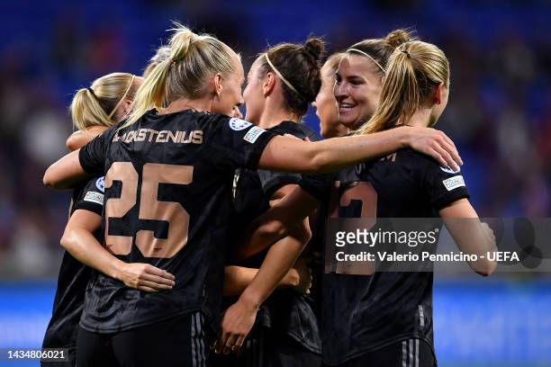 Caitlin Foord of Arsenal celebrates with team mates after scoring their sides first goal during the UEFA Women's Champions League group C match...