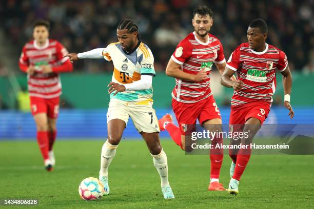 Serge Gnabry of Bayern Munich is marked by Carlos Gruezo of FC Augsburg during the DFB Cup second round match between FC Augsburg and FC Bayern...