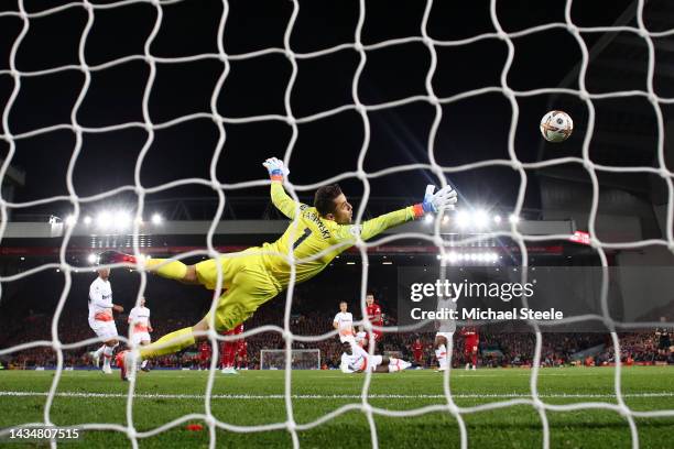 Lukasz Fabianski of West Ham United fails to save a shot from Darwin Nunez of Liverpool which hits the post during the Premier League match between...