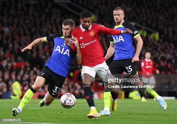 Marcus Rashford of Manchester United is challenged by Ben Davies and Eric Dier of Tottenham Hotspur during the Premier League match between...