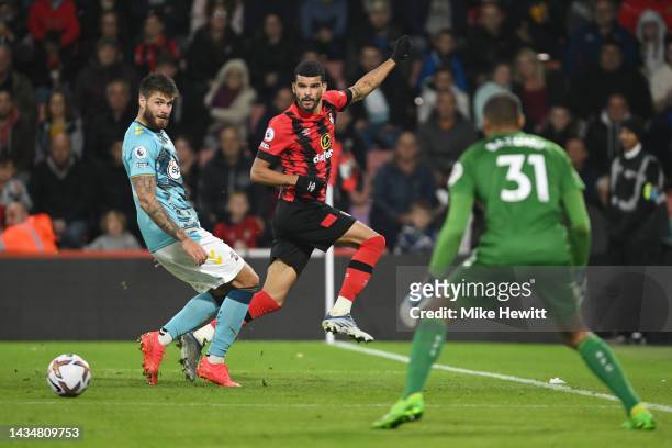 Duje Caleta-Car of Southampton marks Dominic Solanke of AFC Bournemouth during the Premier League match between AFC Bournemouth and Southampton FC at...