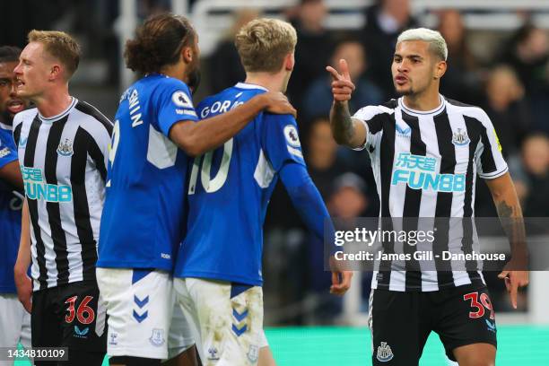 Bruno Guimaraes of Newcastle United clashes with Anthony Gordon of Everton during the Premier League match between Newcastle United and Everton FC at...