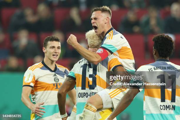 Joshua Kimmich of Bayern Munich celebrates scoring their side's second goal with teammates during the DFB Cup second round match between FC Augsburg...