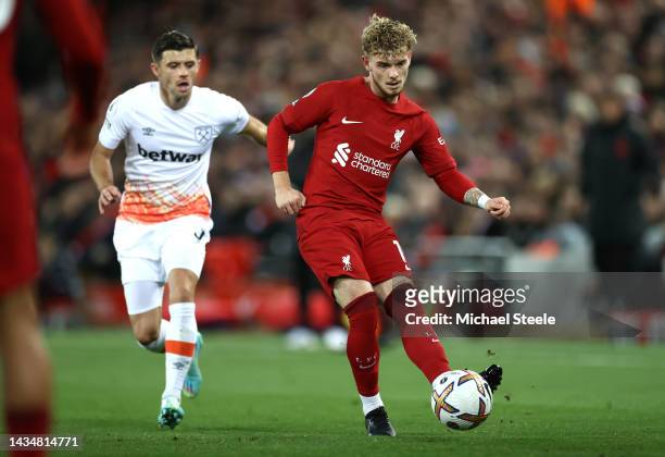 Harvey Elliott of Liverpool is challenged by Aaron Cresswell of West Ham United during the Premier League match between Liverpool FC and West Ham...