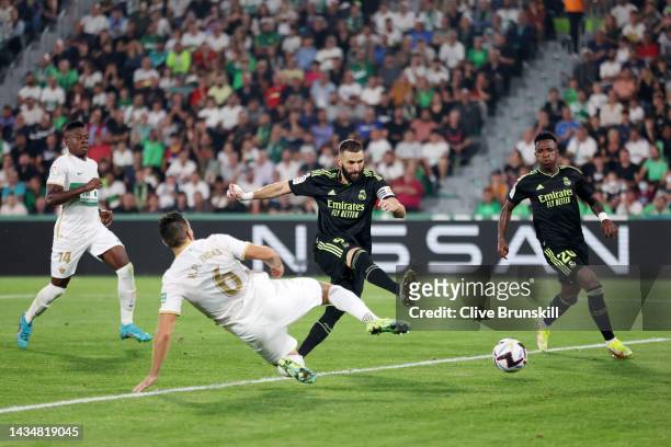 Karim Benzema of Real Madrid scores their sides goal which is later disallowed during the LaLiga Santander match between Elche CF and Real Madrid CF...