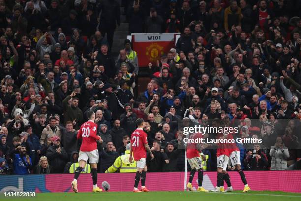 Bruno Fernandes of Manchester United celebrates with team mates after scoring their sides second goal during the Premier League match between...