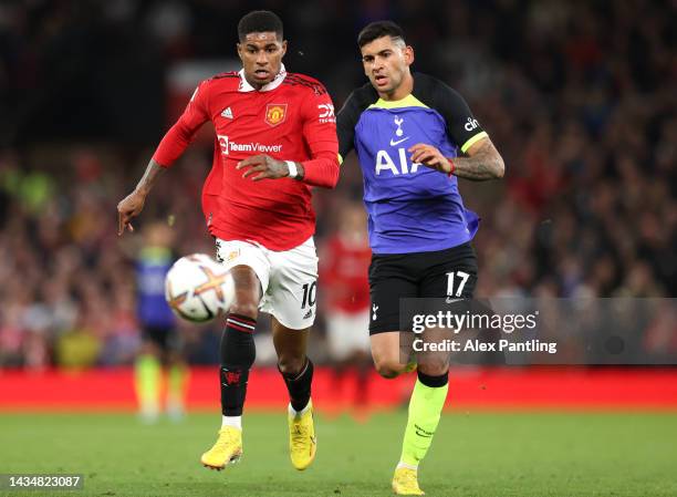 Marcus Rashford of Manchester United runs ahead of Cristian Romero of Tottenham Hotspur during the Premier League match between Manchester United and...