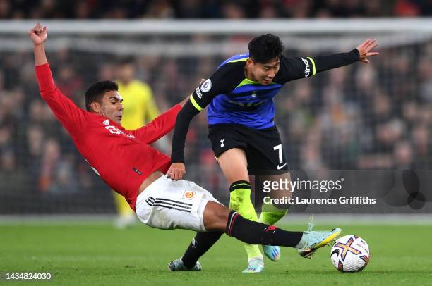 Son Heung-Min of Tottenham Hotspur is tackled by Casemiro of Manchester United during the Premier League match between Manchester United and...
