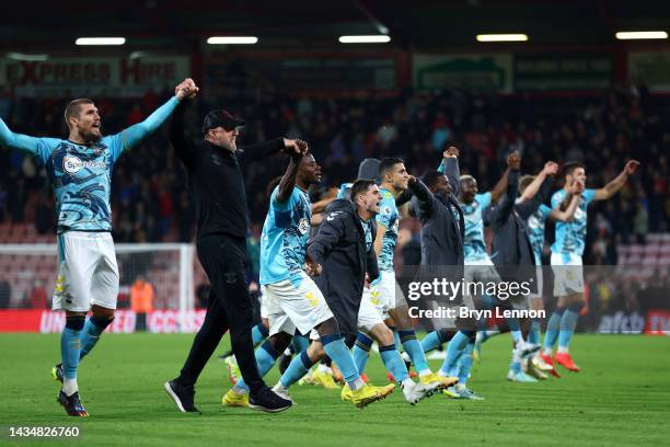 Players of Southampton celebrates their side's win in front of their fans after the final whistle of the Premier League match between AFC Bournemouth...