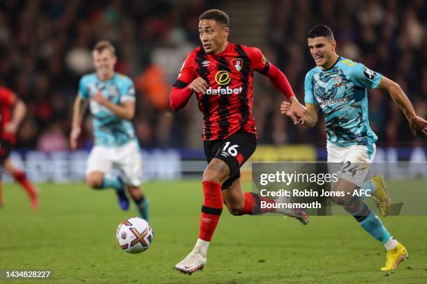 Mohamed Elyounoussi of Southampton gives chase to Marcus Tavernier of Bournemouth during the Premier League match between AFC Bournemouth and...