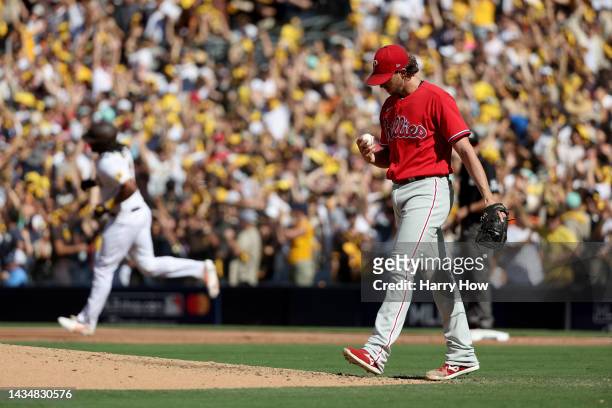 Aaron Nola of the Philadelphia Phillies reacts after allowing a solo home run to Josh Bell of the San Diego Padres during the second inning in game...
