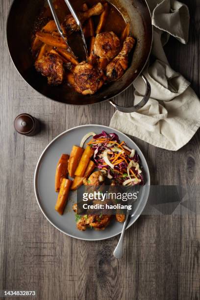 roasted glaze chicken thigh and drums with roasted sweet potato and carrot, fennel, cabbage slaw. - chicken thighs stock pictures, royalty-free photos & images