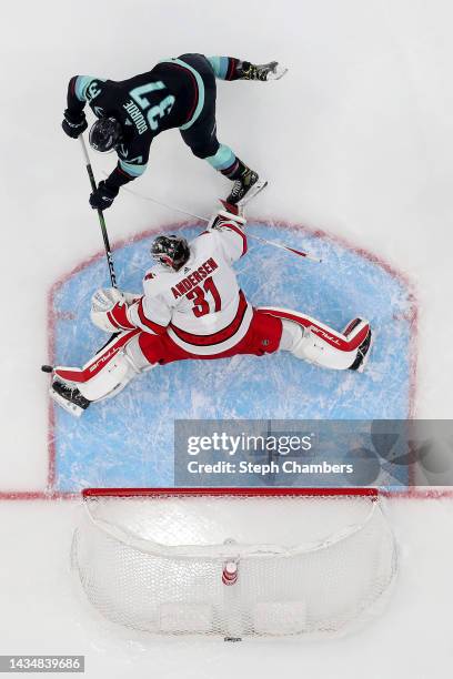 Frederik Andersen of the Carolina Hurricanes makes a toe save against Yanni Gourde of the Seattle Krakenduring the first period at Climate Pledge...