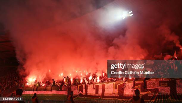 Supoorter of VfL Wolfsburg burn flares during the DFB Cup second round match between Eintracht Braunschweig and VfL Wolfsburg at Eintracht Stadion on...
