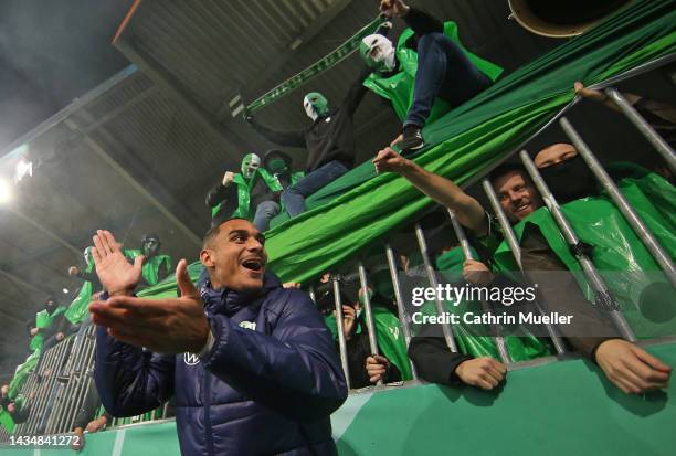 Maxence Lacroix of VfL Wolfsburg celebrates in front of their fans following their side's victory in the DFB Cup second round match between Eintracht...