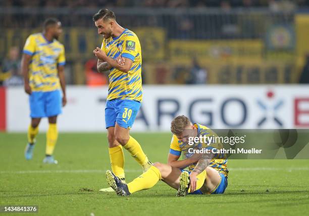 Robin Krausse and Luc Ihorst of Eintracht Braunschweig react during the DFB Cup second round match between Eintracht Braunschweig and VfL Wolfsburg...