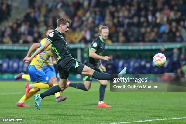 Jakub Kaminski of VfL Wolfsburg scores his sides second goal during the DFB Cup second round match between Eintracht Braunschweig and VfL Wolfsburg...