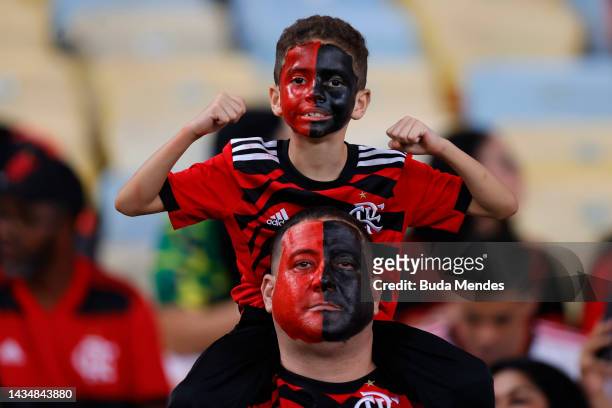 Fans of Flamengo with their faces painted cheer their team prior to the second leg match of the final of Copa do Brasil 2022 between Flamengo and...