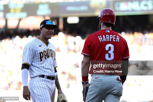 Manny Machado of the San Diego Padres talks with Bryce Harper of the Philadelphia Phillies at third base during the sixth inning in game two of the...