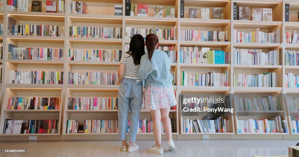 Asian girls finding books