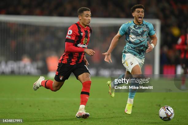 Marcus Tavernier of Bournemouth gets away from Che Adams of Southampton during the Premier League match between AFC Bournemouth and Southampton FC at...