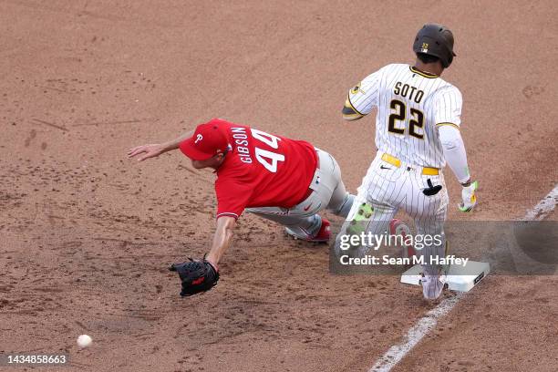 Kyle Gibson of the Philadelphia Phillies is unable to force out Juan Soto of the San Diego Padres at first base during the eighth inning in game two...