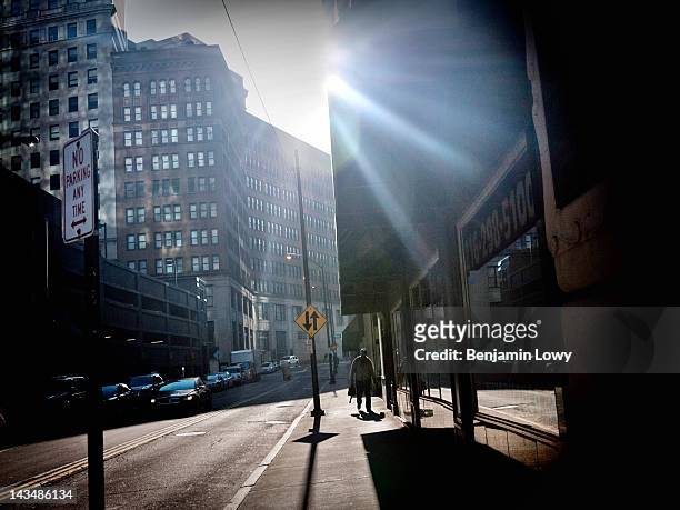 Business men walk through an empty and economically ravaged downtown on February 3, 2012 in Cleveland, OH.