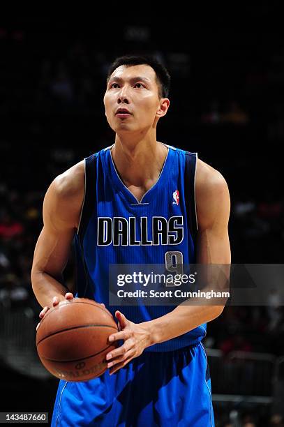 Yi Jianlian of the Dallas Mavericks shoots a foul shot against the Atlanta Hawks on April 26, 2012 at Philips Arena in Atlanta, Georgia. NOTE TO...