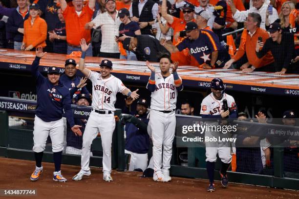 Mauricio Dubon, Yuli Gurriel and Christian Vazquez of the Houston Astros celebrate a home run by Chas McCormick during the sixth inning against the...