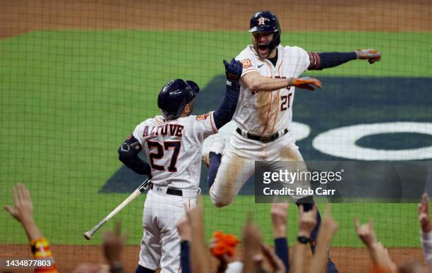 Chas McCormick of the Houston Astros celebrates a home run with Jose Altuve during the sixth inning against the New York Yankees in game one of the...