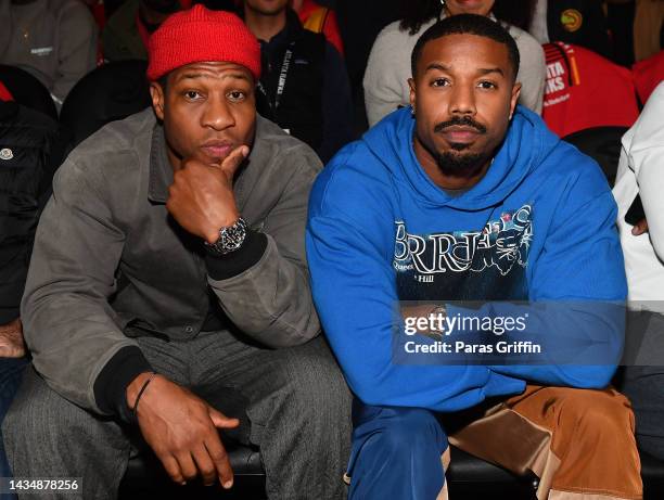 Jonathan Majors and Michael B. Jordan attend the season home opener game between the Houston Rockets and the Atlanta Hawks at State Farm Arena on...