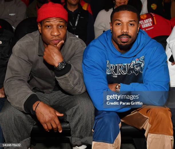 Jonathan Majors and Michael B. Jordan attend the season home opener game between the Houston Rockets and the Atlanta Hawks at State Farm Arena on...