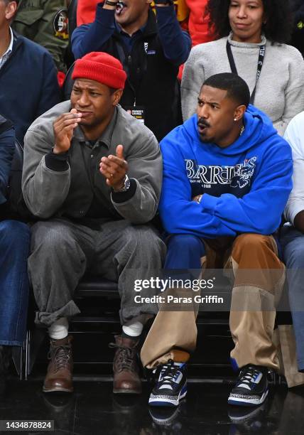 Jonathan Majors and Michael B. Jordan attend the season home opener game between the Houston Rockets and the Atlanta Hawks at State Farm Arena on...