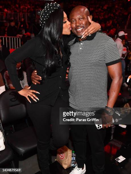 Porsha Williams and Simon Guobadia attend the season home opener game between the Houston Rockets and the Atlanta Hawks at State Farm Arena on...