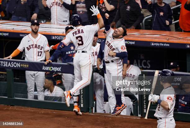 Jeremy Pena of the Houston Astros celebrates a home run with Jose Altuve during the seventh inning against the New York Yankees in game one of the...