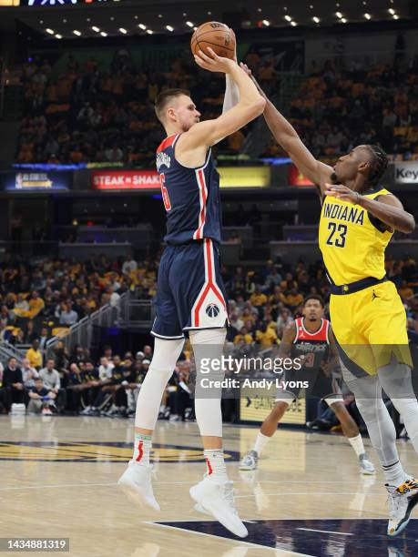 Kristaps Porzingis of the Washington Wizards shoots the ball against the Indiana Pacers at Gainbridge Fieldhouse on October 19, 2022 in Indianapolis,...