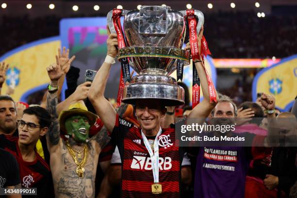 Filipe Luís of Flamengo celebrates with the trophy after winning the second leg match of the final of Copa do Brasil 2022 between Flamengo and...