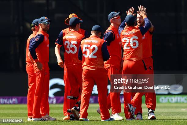 Paul van Meekeren of the Netherlands celebrates with team mates after taking the wicket of Pathum Nissanka of Sri Lanka for 14 runs during the ICC...
