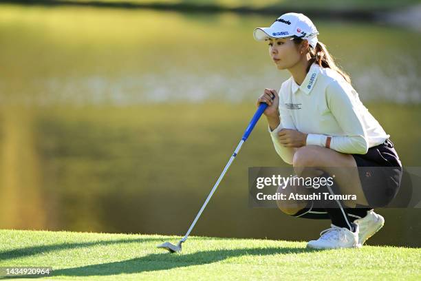 Ayaka Matsumori of Japan lines up a putt on the 15th green during the first round of the Nobuta Group Masters GC Ladies at Masters Golf Club on...