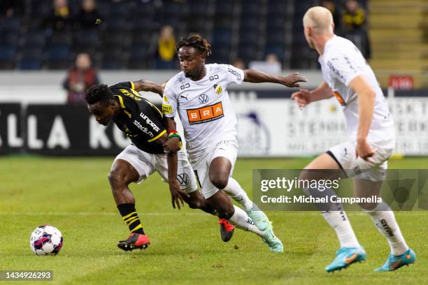 AIKs Erick Otieno in a duel with Hackens Ibrahim Sadiq during an Allsvenskan between AIK and BK Hacken at Friends arena on October 19, 2022 in Solna,...