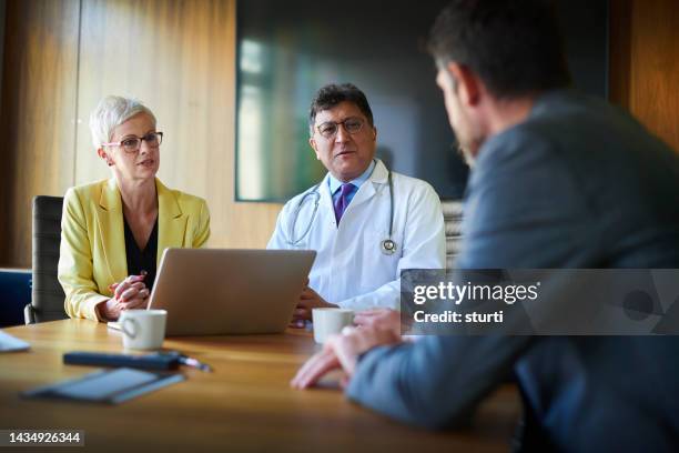 medical business meeting - tribunal stock pictures, royalty-free photos & images
