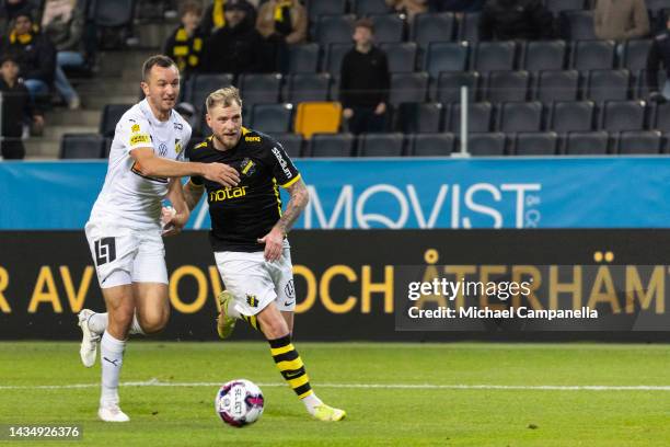 Hackens Evan Hovland in a duel with AIKs John Guidetti during an Allsvenskan between AIK and BK Hacken at Friends arena on October 19, 2022 in Solna,...