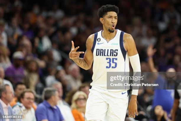 Christian Wood of the Dallas Mavericks reacts to a three-point shot against the Phoenix Suns during the second half of the NBA game at Footprint...