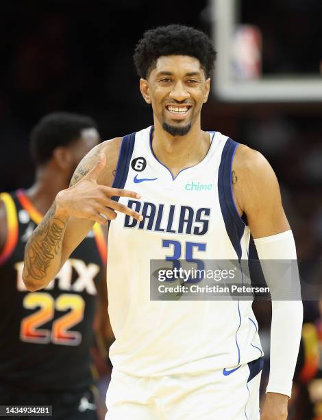 Christian Wood of the Dallas Mavericks reacts to a three-point shot against the Phoenix Suns during the second half of the NBA game at Footprint...