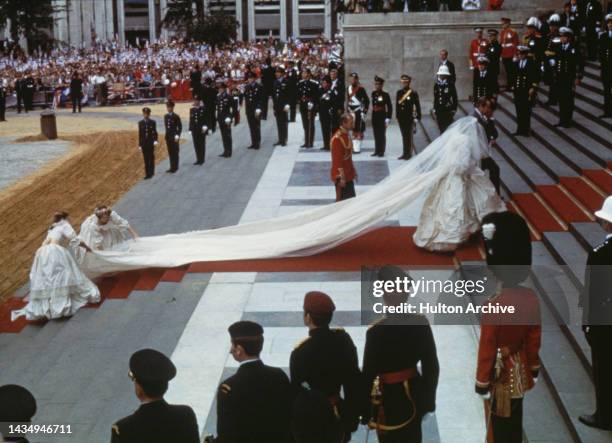 The wedding of Charles, Prince of Wales, and Lady Diana Spencer, at St Paul's Cathedral in London on July 29th, 1981. Diana is walking up the steps...