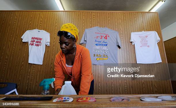 Kilalah Scales works in her T-Shirt shop near the intersection of Florence and Normandy Avenues in South Los Angeles on April 27, 2012 in Los...
