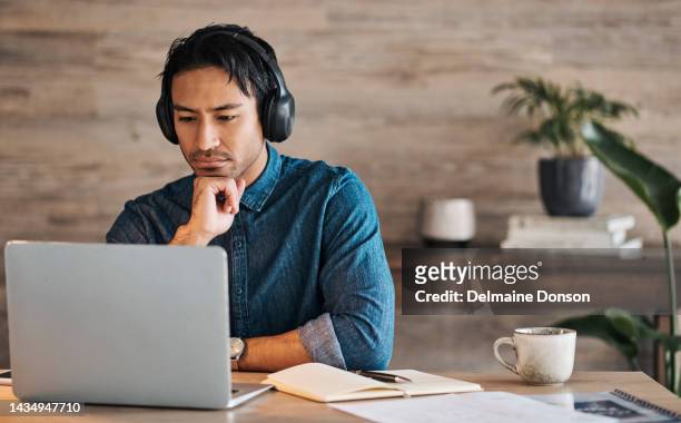 businessman, headphones and laptop webinar in office with coffee on table, video call or watching video. zoom call, video conference and male from canada in online meeting with book and pen on desk. - mid adult men stock pictures, royalty-free photos & images