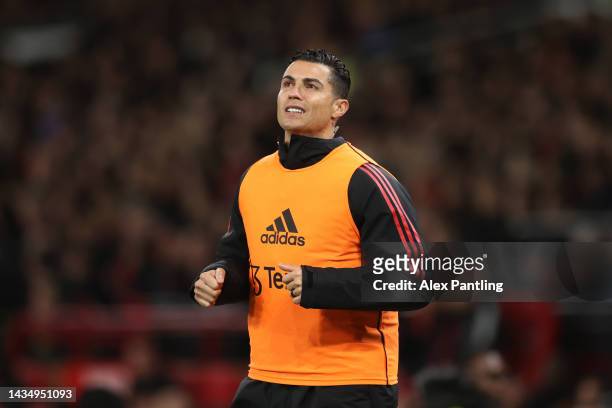 Cristiano Ronaldo of Manchester United warms up on the touchline during the Premier League match between Manchester United and Tottenham Hotspur at...
